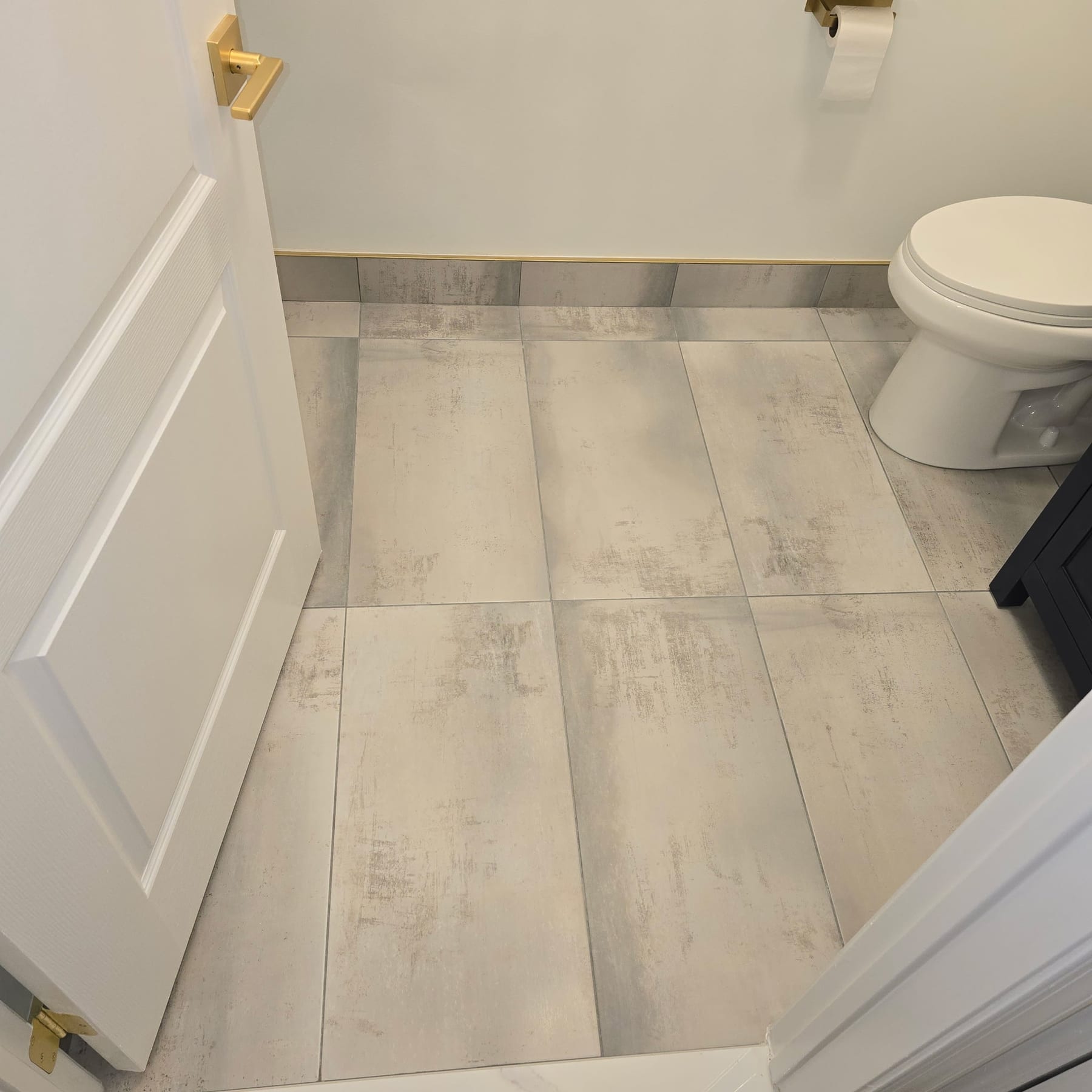 Gold trim detail at floor