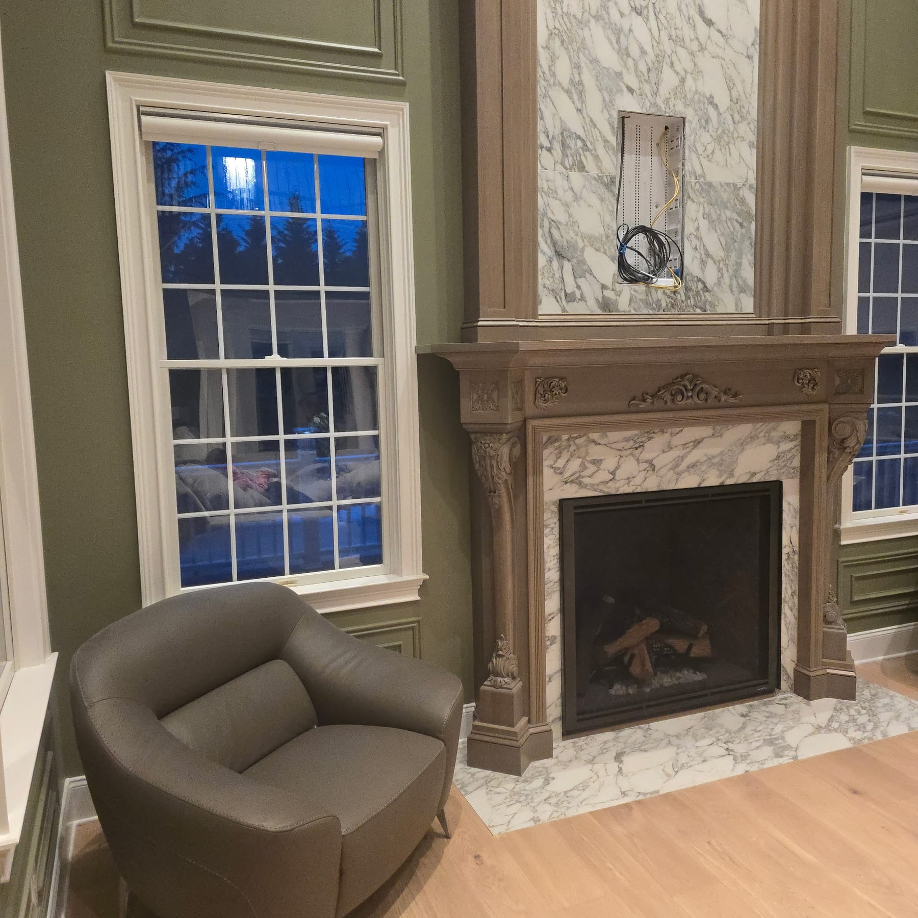 Finished family room with marble fireplace