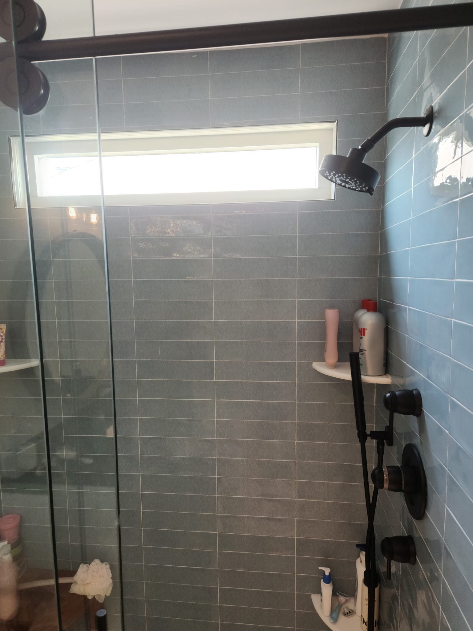 Blue-glass shower with black hardware